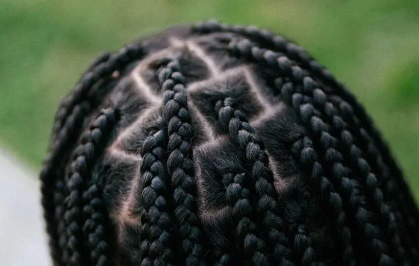 close up of braids showing scalp tension from tight braids and braid bumps