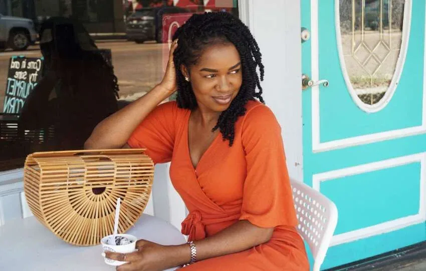 Woman wearing shoulder-length mini twists on natural hair