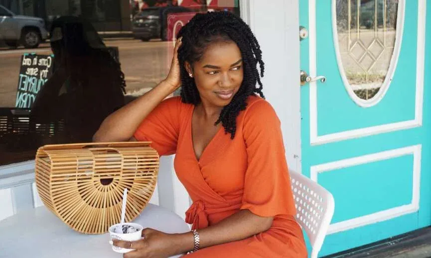 Woman wearing shoulder-length mini twists on natural hair