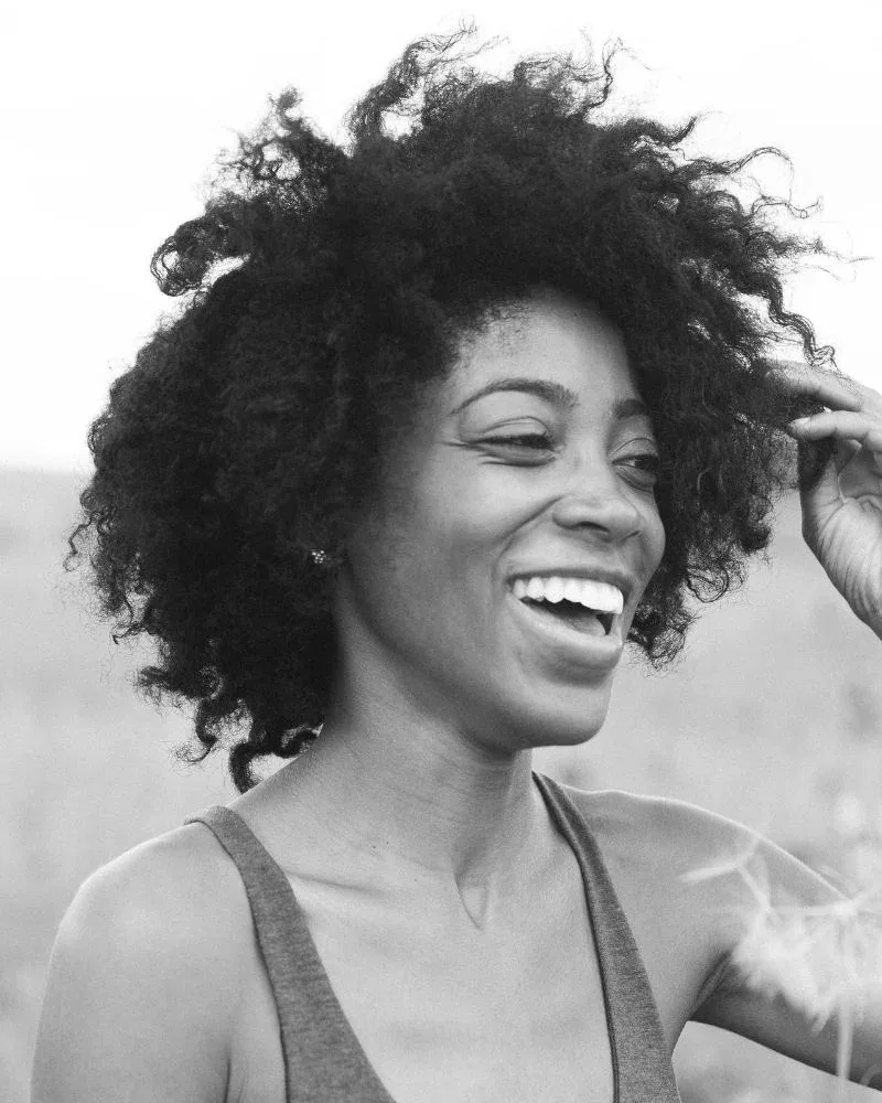 Black-and-white portrait of a woman with a full natural afro.