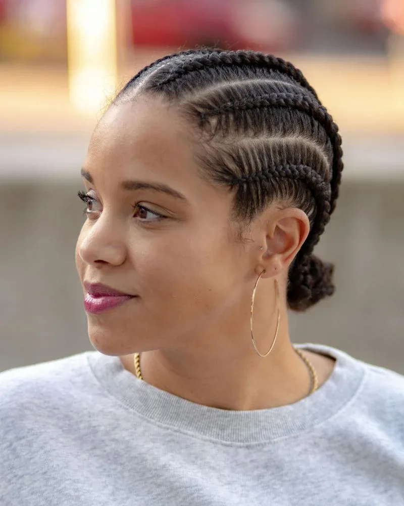 natural hair in cornrows used as a protective style to reduce breakage