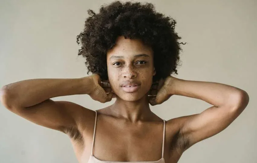 Natural 4C hair texture on Black woman with defined coils and healthy strands