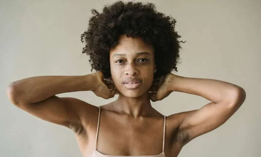 Natural 4C hair texture on Black woman with defined coils and healthy strands