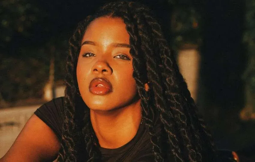 Woman wearing a low manipulation twist hairstyle for fine natural hair