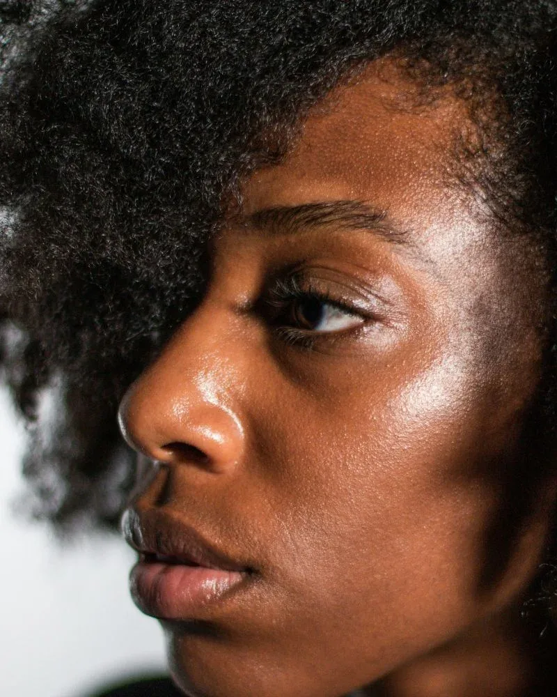 Woman with natural Type 4 hair illustrating healthy hair strength and texture