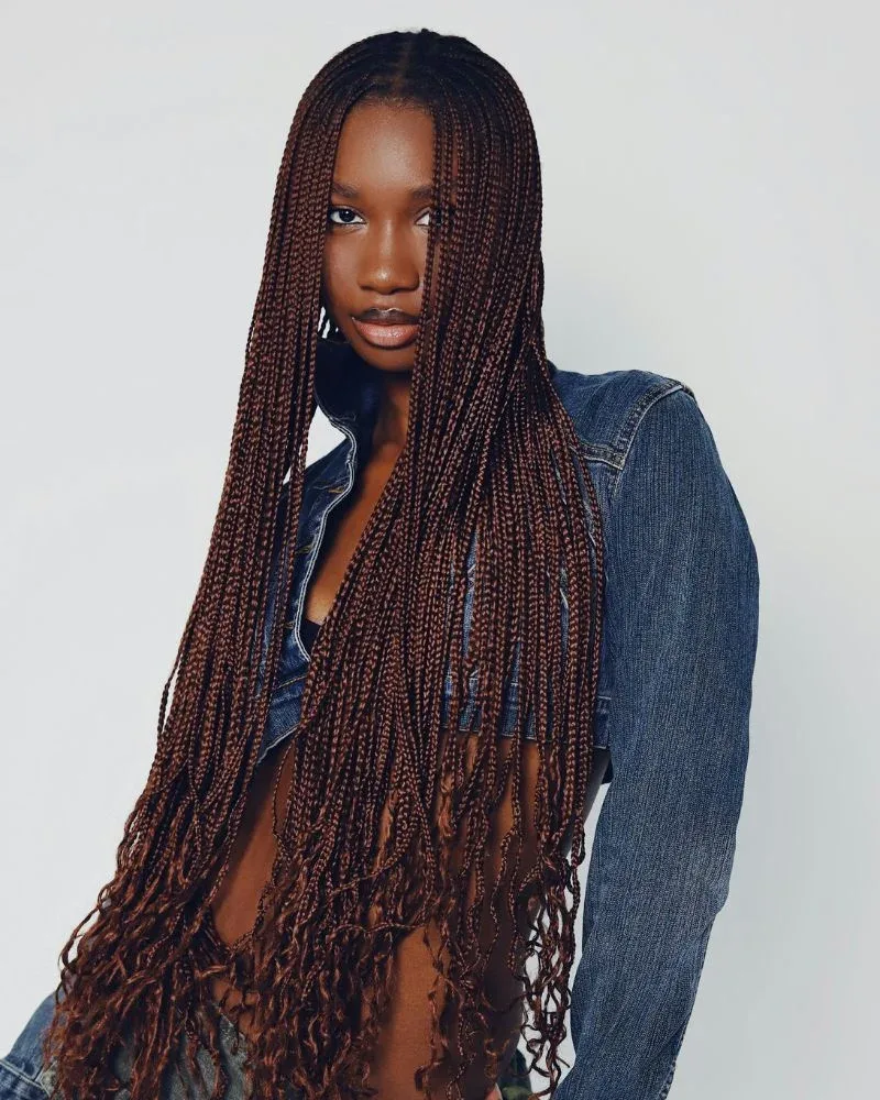 Woman wearing long box braids installed with hair extensions