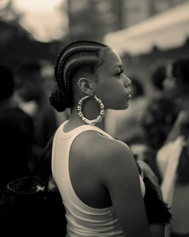 Medium cornrows styled close to the scalp on natural hair
