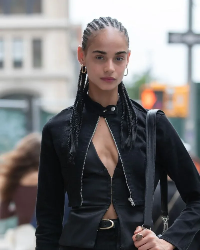 Woman wearing neat natural hair cornrows with her own hair