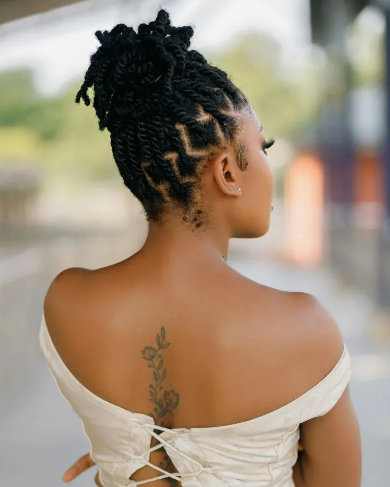 Two strand twists styled into an updo on fine natural hair