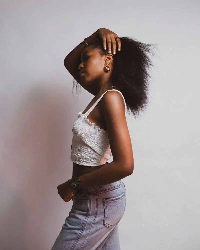 Woman wearing her natural hair in a fluffy, stretched blowout