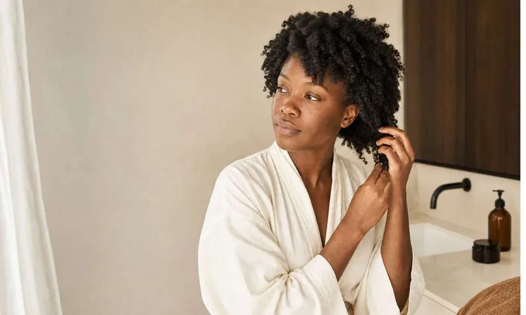 Woman preparing her Type 4 hair for a simple wash day routine